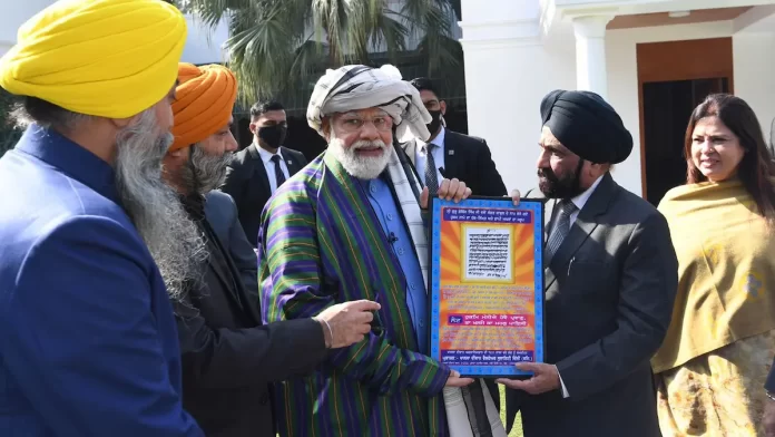 PM Modi meeting members of the Afghan Sikh and Hindu delegation at his residence in New Delhi